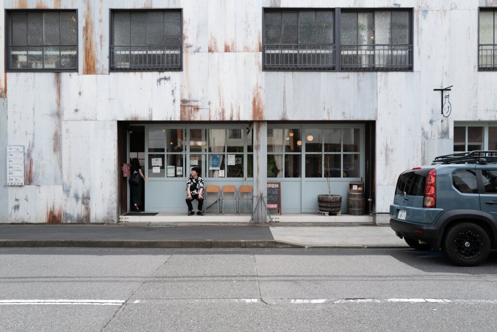 Charming café facade in Japan with rustic vibes, perfect for a cultural stop on your Japan tour journey.